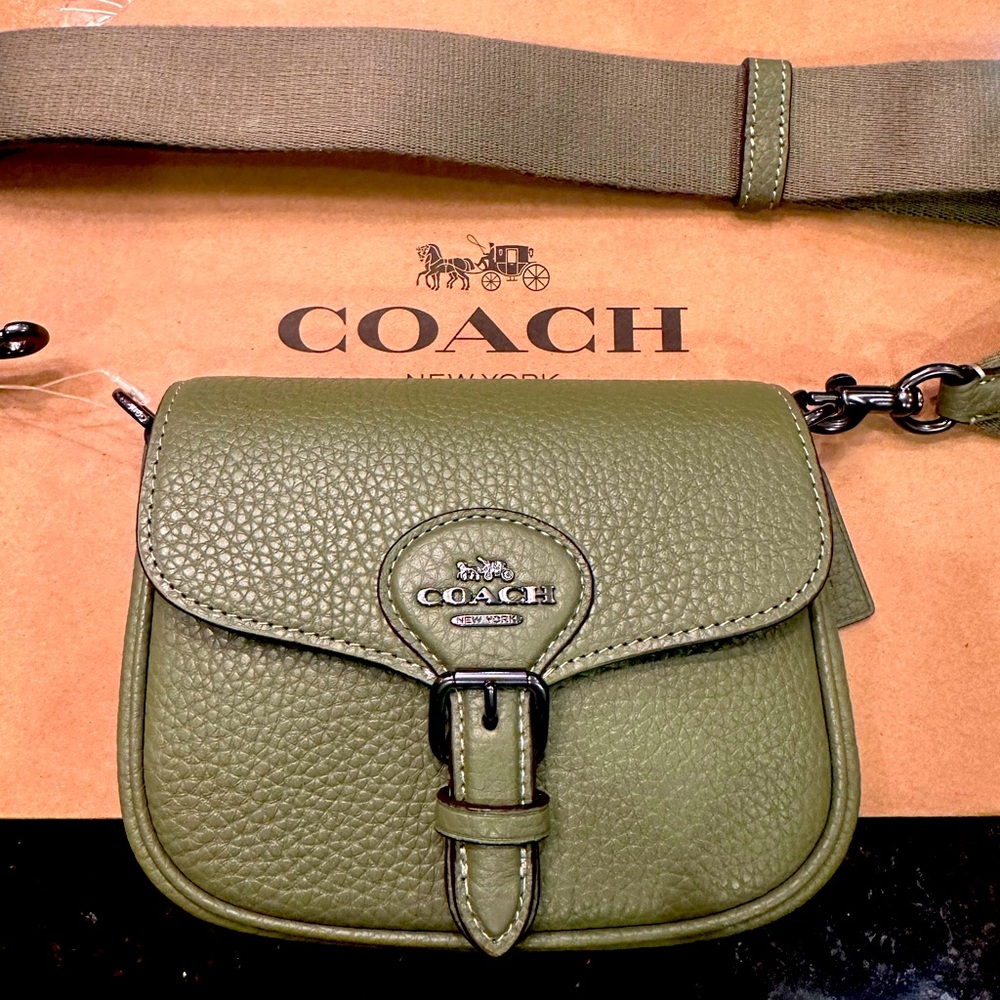 Leather coach crossbody.  Olive green leather with strap. 4 by 6.